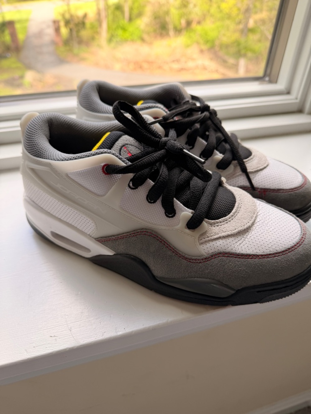 Kids Jordan 4 Grey and White Athletic Sneakers with Black Laces